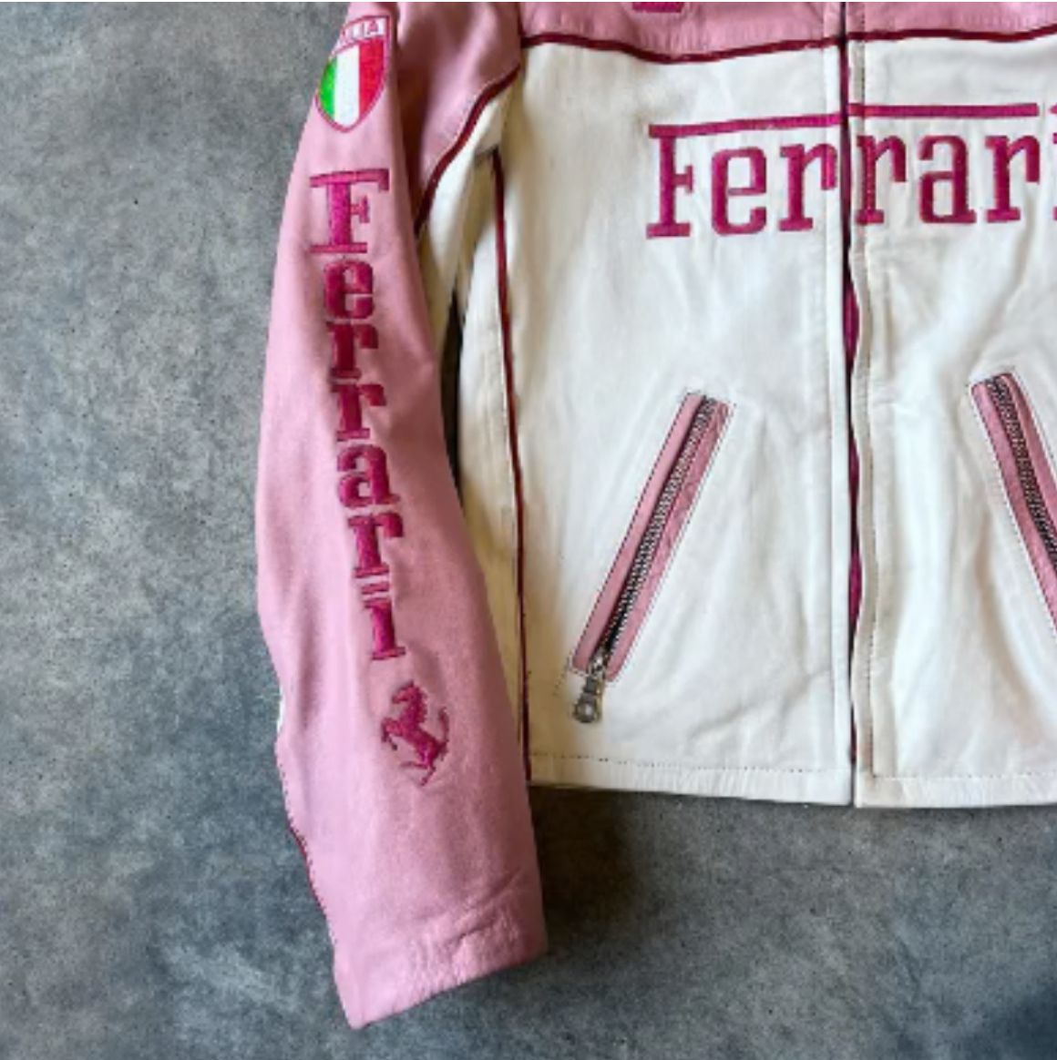 Sleeve detail with sponsor patches on limited edition pink Ferrari jacket