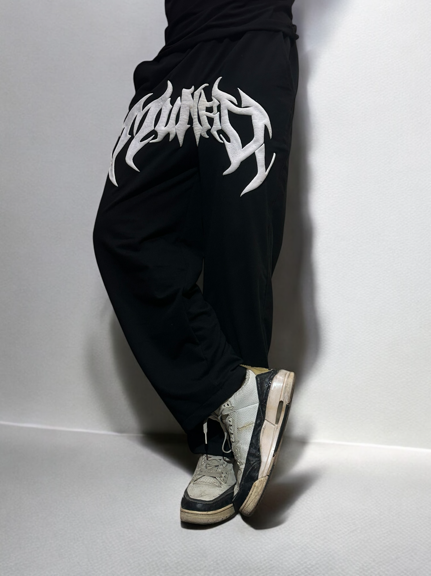 Side angle of Puffy Black Baggy Pant highlighting voluminous streetwear fit