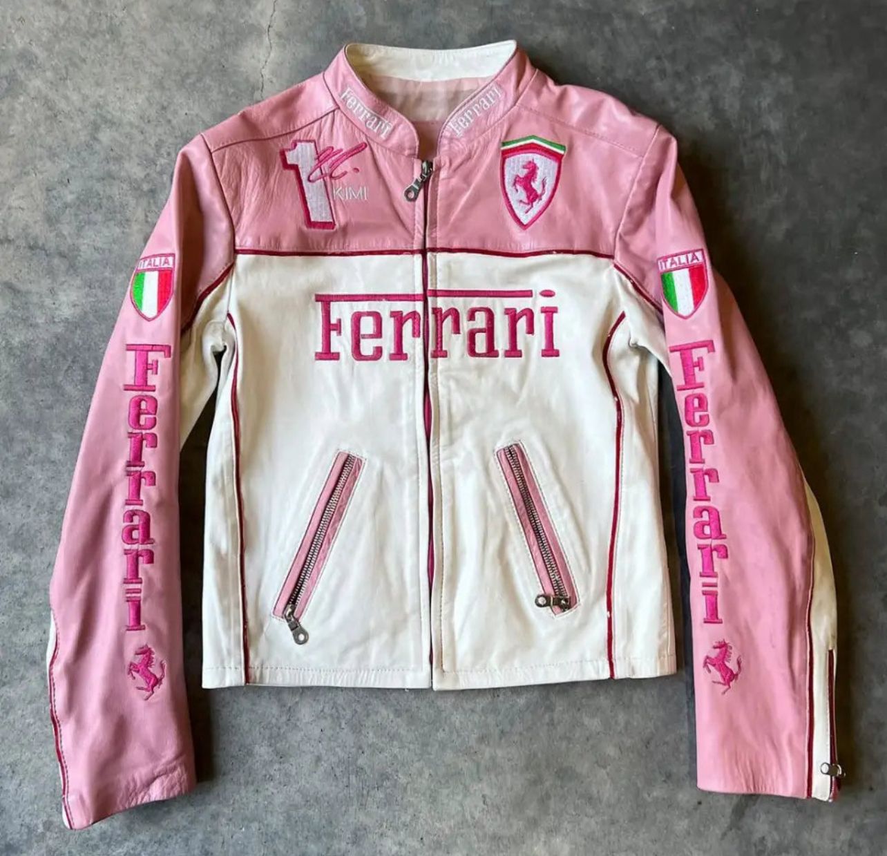 Front view of limited edition pink Ferrari leather jacket with embroidered logo