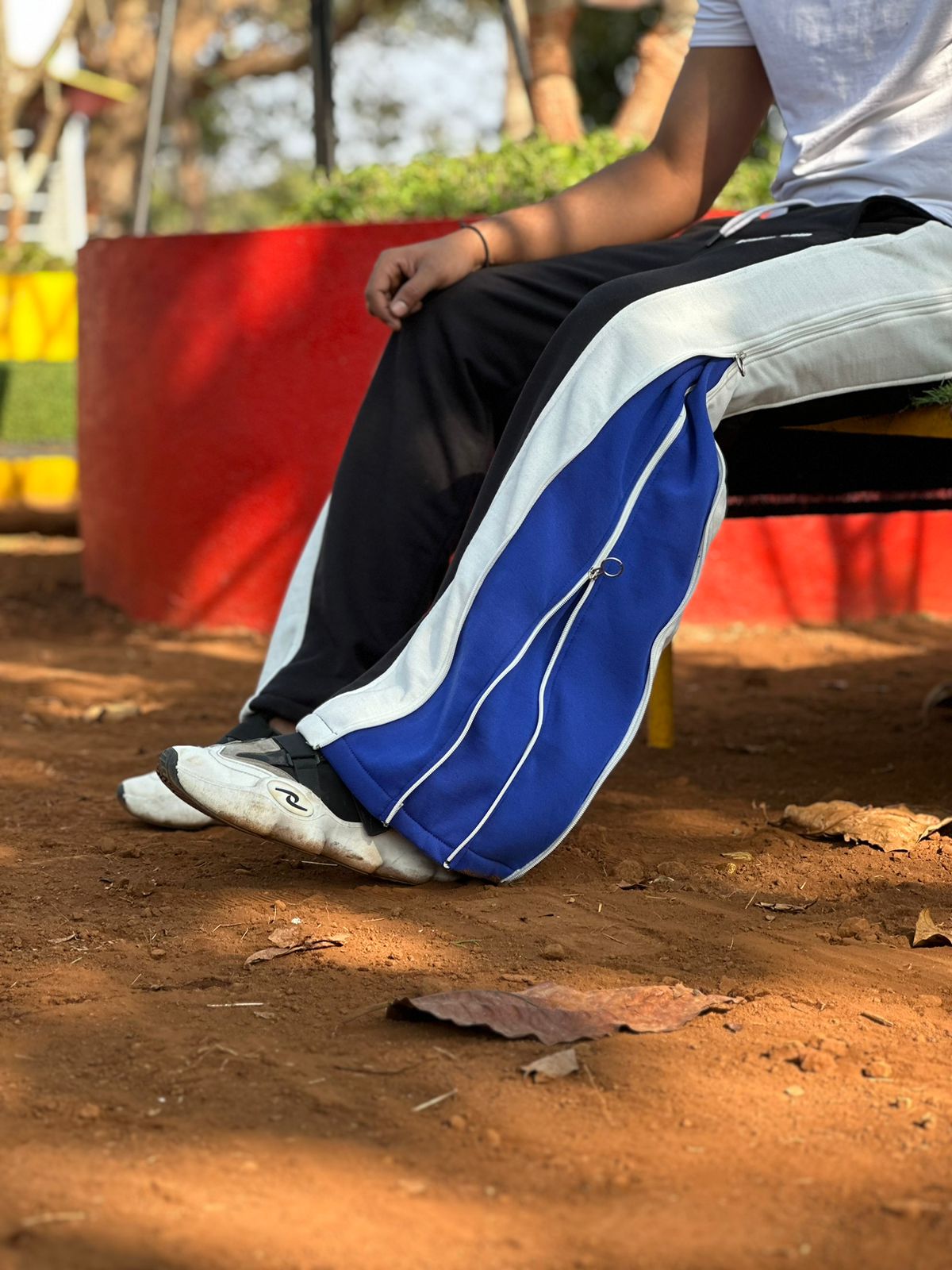 Side angle of Zip Trip Baggy Fit Pant highlighting relaxed baggy silhouette