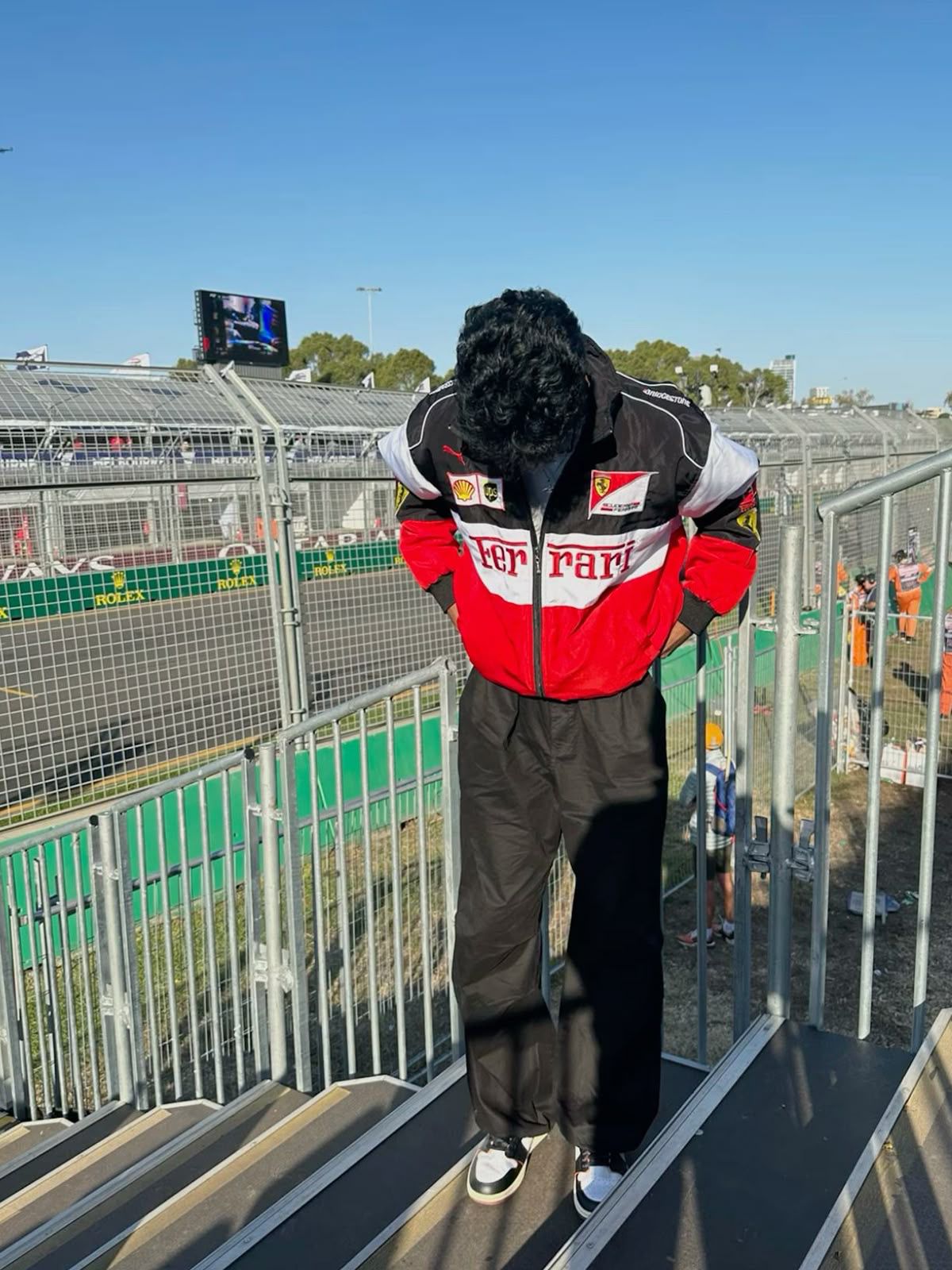βFront design of red, black, and white Ferrari racing jacket with embroidered logosβ