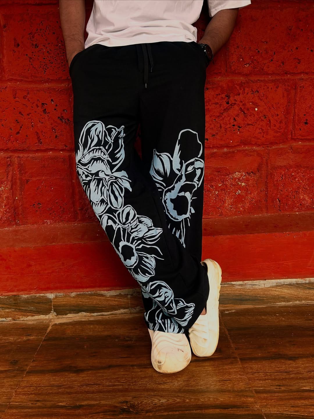 Model styling pant with oversized tee — full-look image