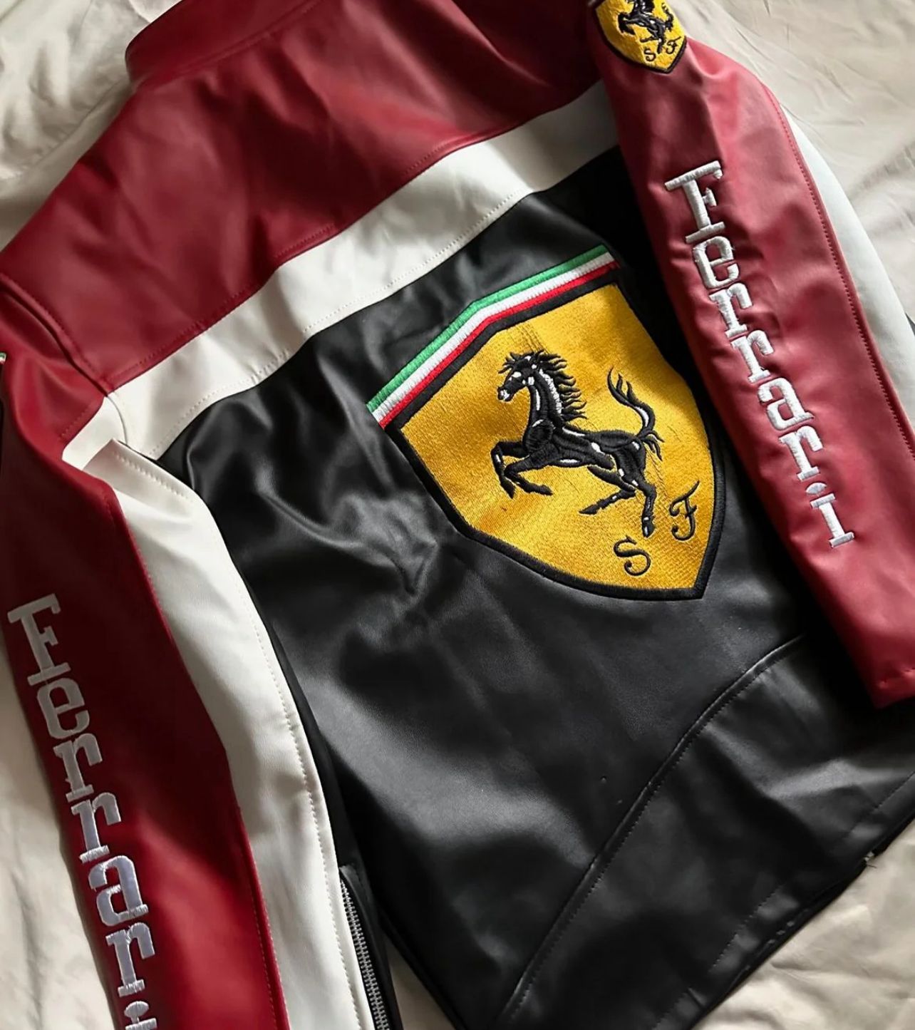 Back view of Ferrari motorsport jacket with sponsor-style embroidery