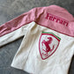 Back view of pink Ferrari jacket featuring motorsport sponsor patches