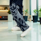 Side view showcasing straight fit and flame graphic design