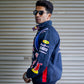Side profile of Red Bull F1 jacket showing detailed stitching and oversized fit