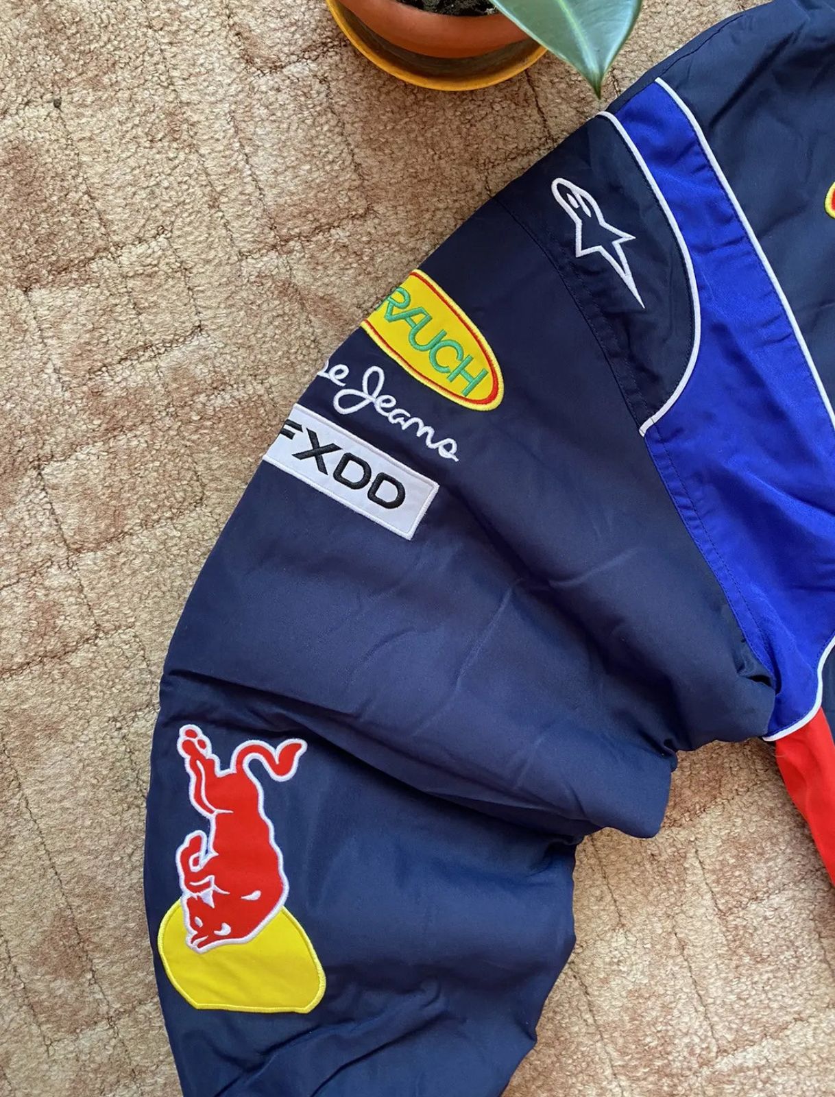 Stitching detail on Red Bull Racing Jacket – faux leather embroidered design